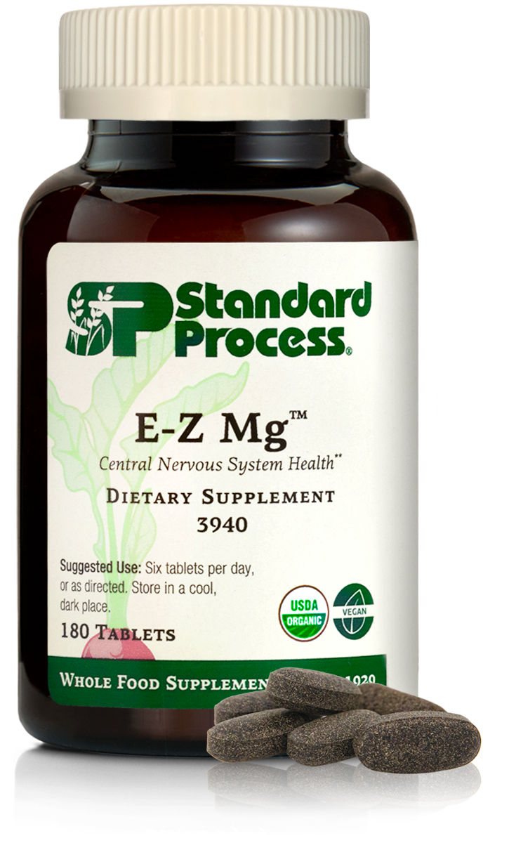 Image of E-Z Mg bottle next to tablets of magnesium supplements.