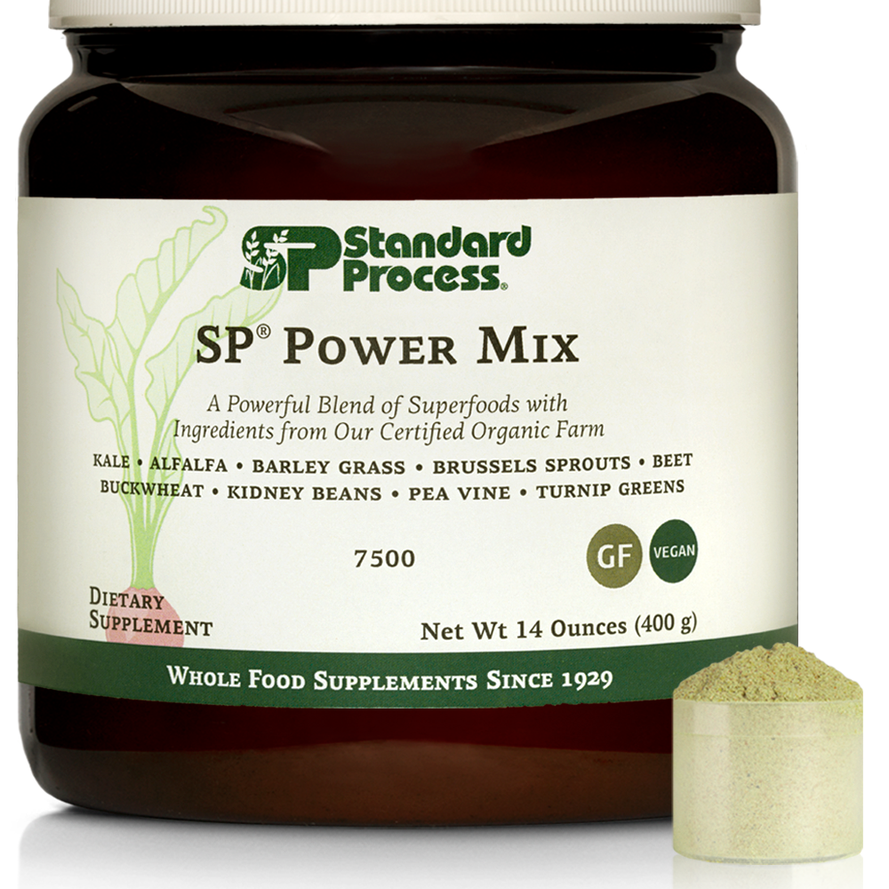 Tub of SP Power Mix next to a scoop of the green powder.
