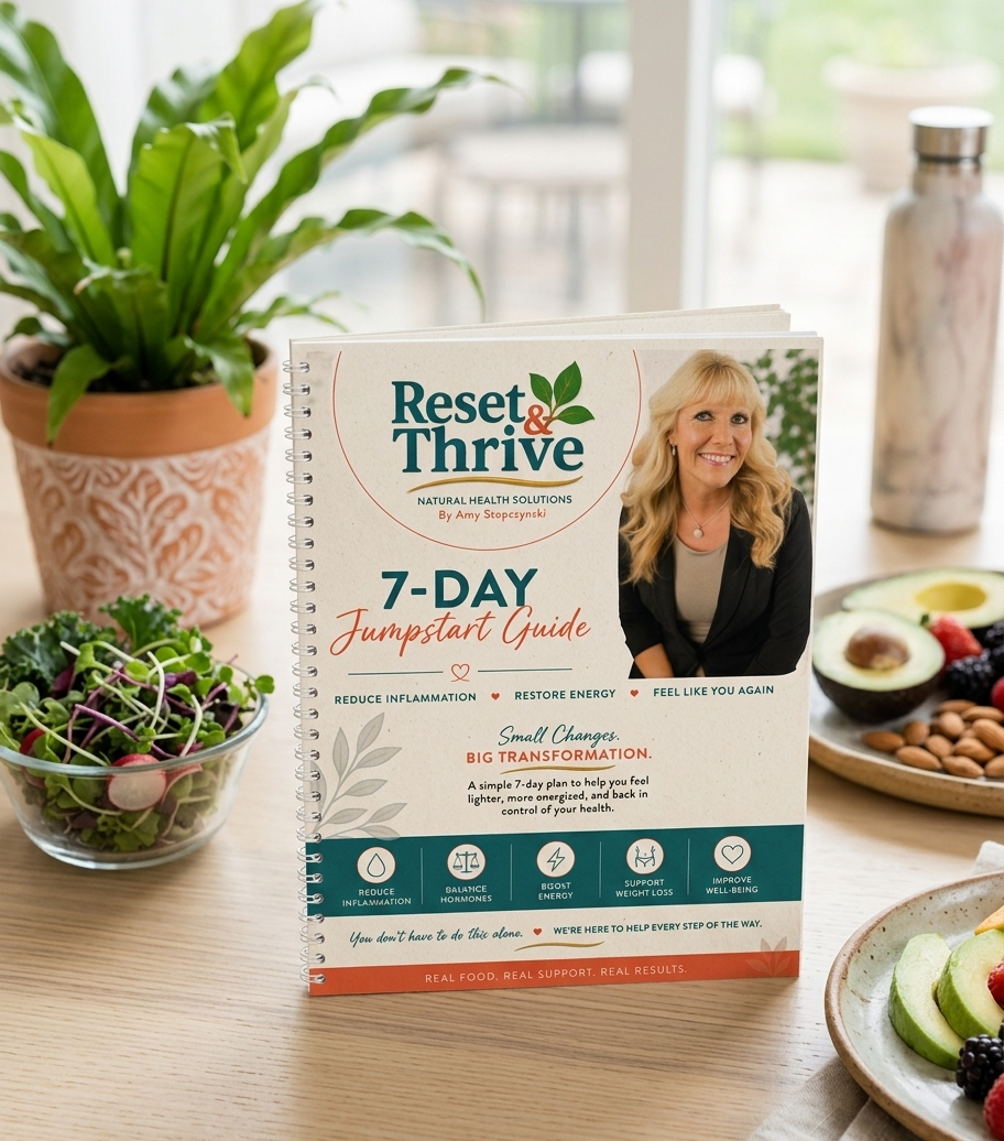 Reset & Thrive 7-Day Jumpstart Guide on a table with health-related items